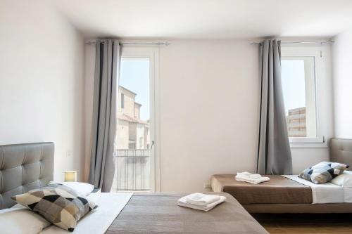 Ένα ή περισσότερα κρεβάτια σε δωμάτιο στο San Vincenzo Rooms Vigonza