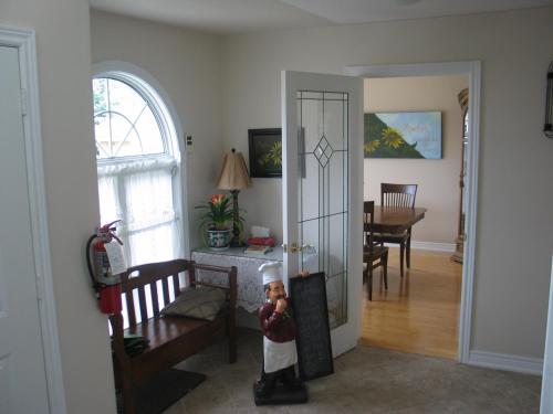 a figurine of a chef standing in a living room at Arnica Bed & Breakfast in Niagara on the Lake