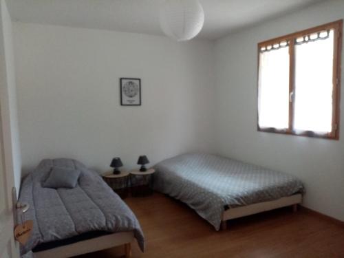 Ένα ή περισσότερα κρεβάτια σε δωμάτιο στο Quiétude et confort
