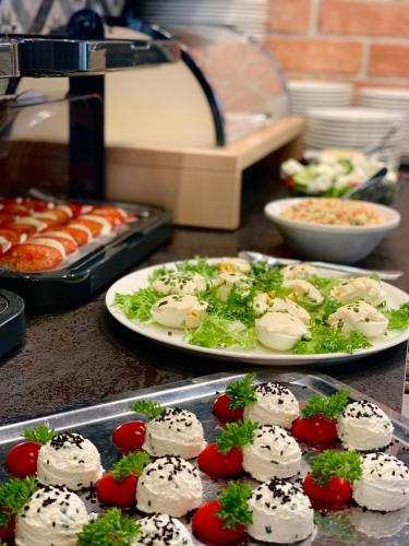 a table with two plates of food on a counter at Piwnica Rycerska Kęty in Kęty