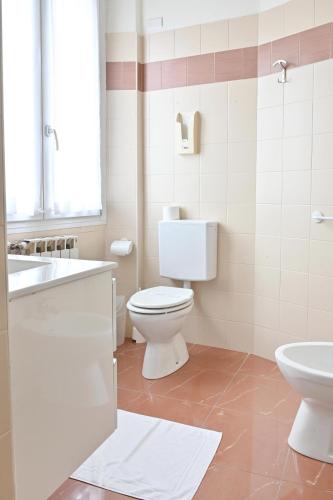 a bathroom with a toilet and a sink at Hotel Marco's in Como
