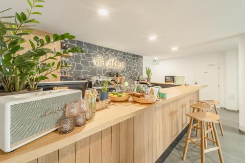 a kitchen with a counter with food on it at Zuberka Vila Zuberec in Zuberec