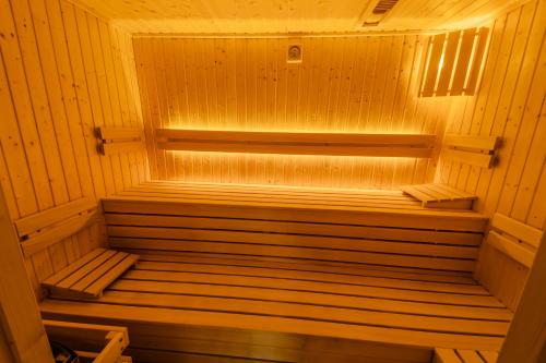 a wooden sauna with a bench in the middle at Zuberka Vila Zuberec in Zuberec