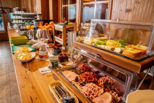 a buffet line with many different types of food at Almwelt Austria in Schladming