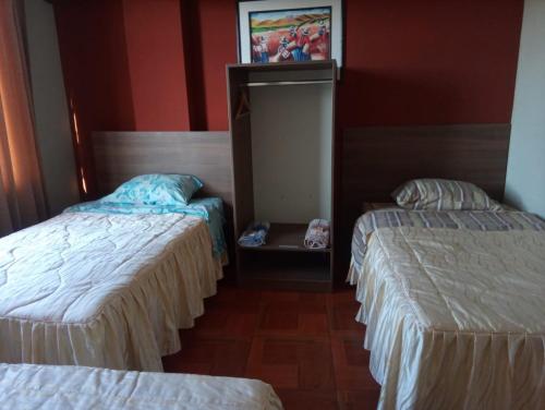 Ένα ή περισσότερα κρεβάτια σε δωμάτιο στο Cálido Hostal