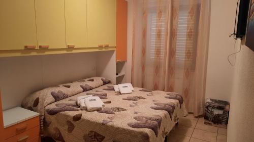 a bedroom with two beds in a room at Desulo - B&B Perla Del Gennargentu in Desulo