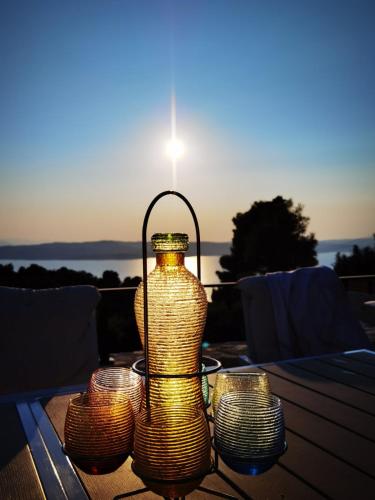 a group of lights sitting on top of a table at Damari Luxury Retreat Villas Skiathos in Skiathos Town