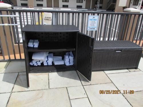 a black container with rolls of toilet paper at Quality Inn & Suites Kissimmee by The Lake in Orlando