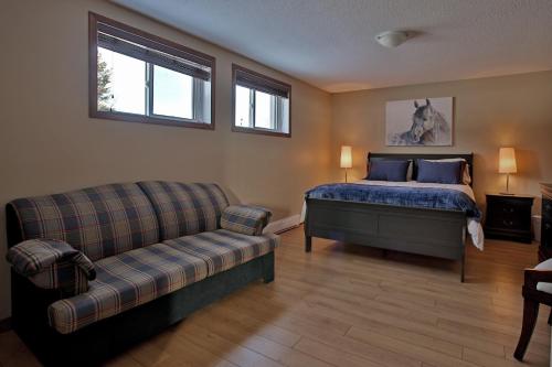Ein Bett oder Betten in einem Zimmer der Unterkunft Ranch St-Hubert