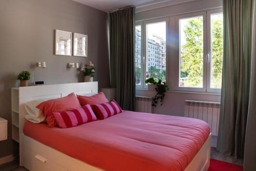 A bed or beds in a room at Zamora Suites Central