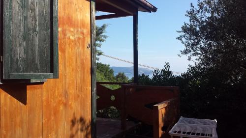 a door to a house with a view of a window at Agriturismo Valle di Marco in Palinuro