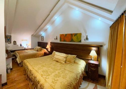 a bedroom with two beds in a room at Casa San Marcos by Prima Collection in Quito