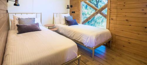 Cama o camas de una habitación en La Dehesa Experiences