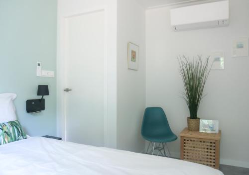 Кровать или кровати в номере Rietreiger luxe vakantielodge in Friesland - 2 badkamers