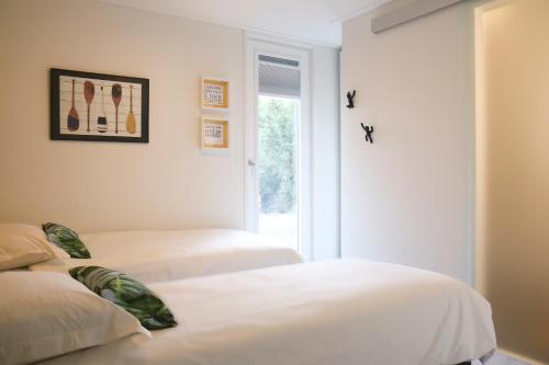 Кровать или кровати в номере Rietreiger luxe vakantielodge in Friesland - 2 badkamers