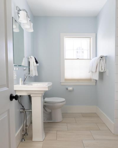 a white bathroom with a sink and a toilet at The Sailmaker's House in Portsmouth