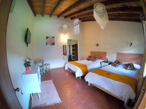 Postel nebo postele na pokoji v ubytování Hotel La Casona Real