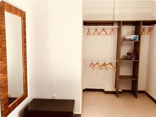 a room with a closet with hangers at My Beach Condo RG5 in Puerto Vallarta