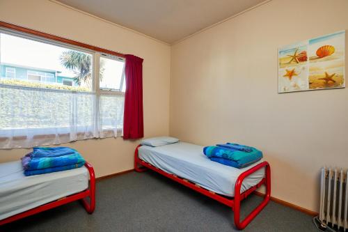Postel nebo postele na pokoji v ubytování Dolphin Lodge