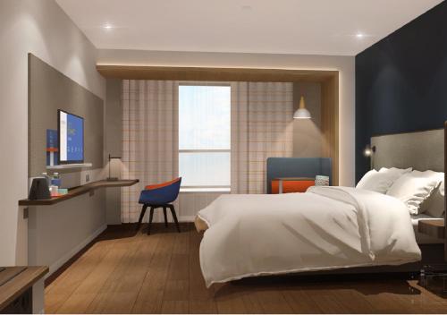 Postel nebo postele na pokoji v ubytování Holiday Inn Express Xi'an High Tech South by IHG