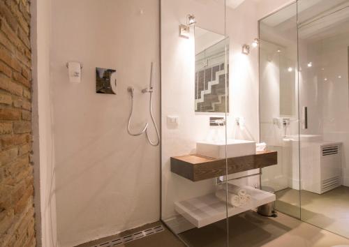 a bathroom with a glass shower and a sink at Residenza Amblingh in Vasto