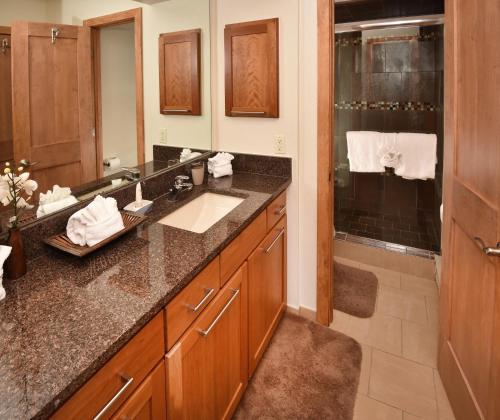 a bathroom with a sink and a shower at Vantage Point 101 Condo in Vail