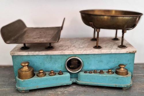 a miniature scale with a bowl on top of it at Lettu di Ita - Spectacular Gallura Stazzu with sea view and pool in Santa Teresa Gallura