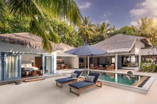 an image of a villa with a swimming pool at Raffles Maldives Meradhoo in Gaafu Alifu Atoll