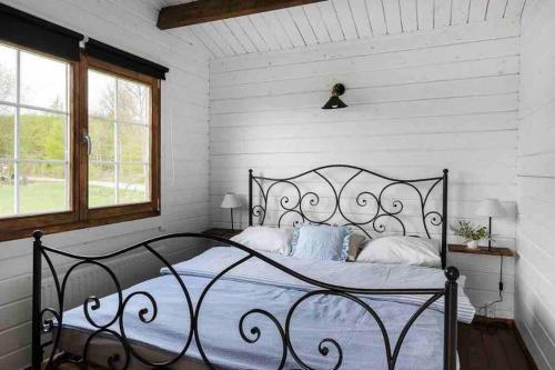 Posteľ alebo postele v izbe v ubytovaní Cozy Cottage near lake