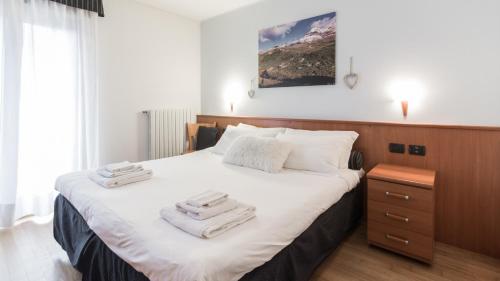 Ein Bett oder Betten in einem Zimmer der Unterkunft Residence Pizzo Scalino