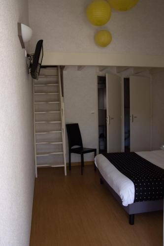 a bedroom with a bed and a ladder and a chair at Rev'hotel in Ribérac