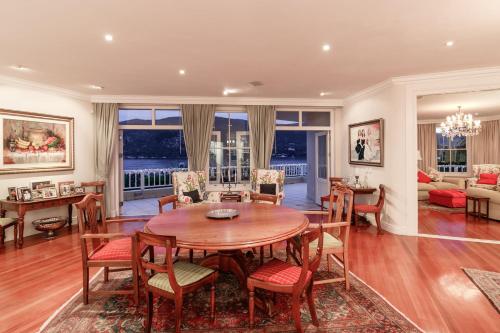a dining room with a table and chairs at Isola Bella Guest House in Knysna