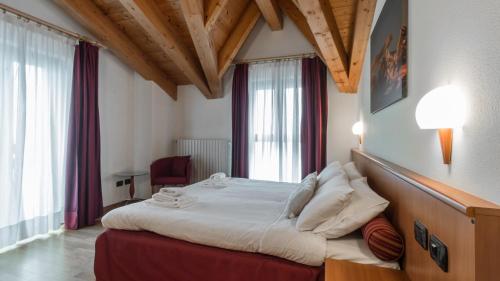 Ein Bett oder Betten in einem Zimmer der Unterkunft Residence Pizzo Scalino
