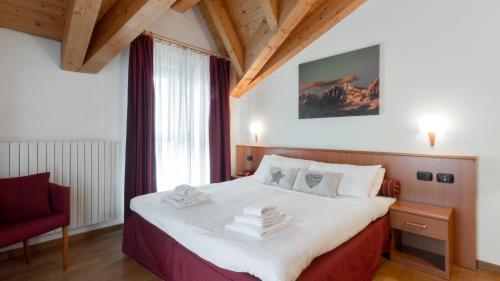 Postel nebo postele na pokoji v ubytování Residence Pizzo Scalino