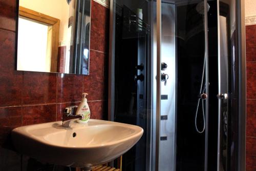 a bathroom with a sink and a shower at Gungas in Ādaži