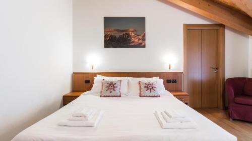 Ein Bett oder Betten in einem Zimmer der Unterkunft Residence Pizzo Scalino