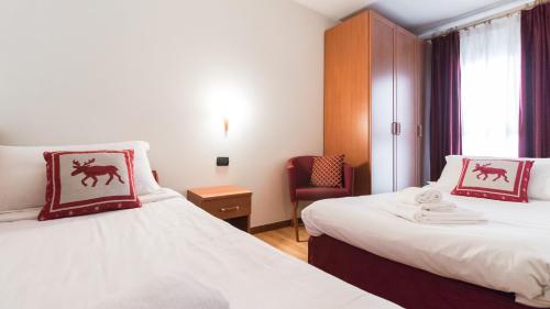 Ein Bett oder Betten in einem Zimmer der Unterkunft Residence Pizzo Scalino
