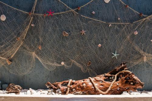 a close up of a net and some rocks at Makis studios By La skala Vista in Skala Kefalonias