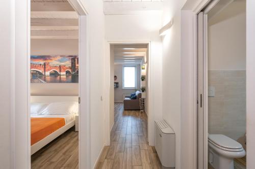 a small bedroom with a bed and a bathroom at La Nuova Corte Verona in Verona