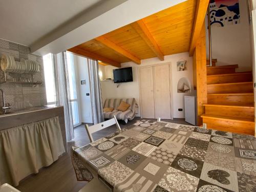 a room with a table and a living room at Magi - Zeus in Ponza