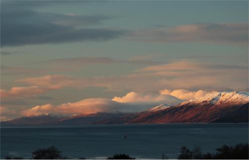 a view of a mountain range with snow covered mountains at Roam West in Fort William