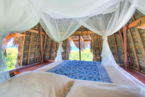 Postel nebo postele na pokoji v ubytování Ngalung Kalla Retreat