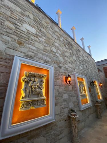 a framed picture on the side of a building at Villa Ephesus Hotel in Kusadası