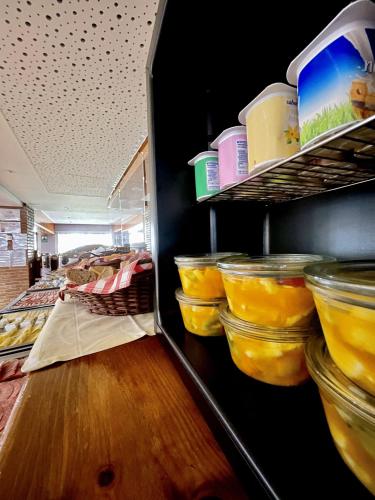 a refrigerator filled with lots of food in jars at GoettenMar Platja d'Aro in Platja  d'Aro