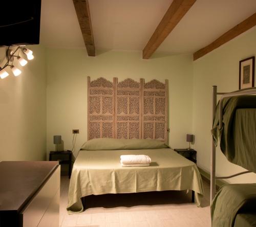 a bedroom with a bed and a wall at Villa Nicodemo in Paestum