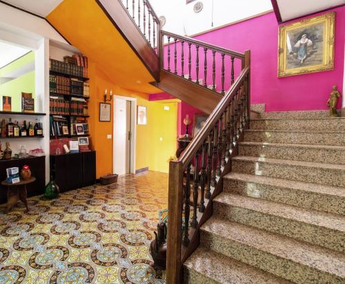 a staircase in a house with colorful walls at Villa Nicodemo in Paestum