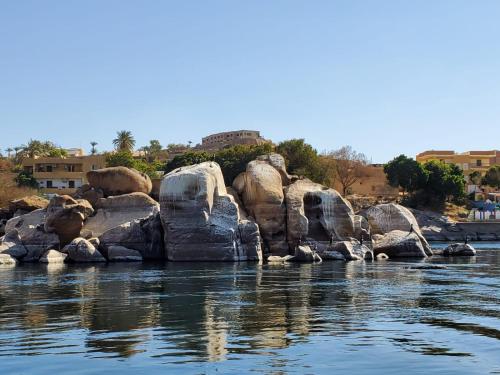 a group of large rocks in the water at Aswan Nubian House in Aswan