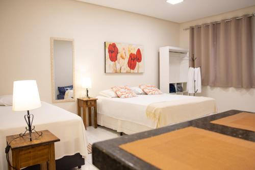 Säng eller sängar i ett rum på Flats Premium Jabaquara