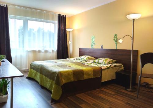 Кровать или кровати в номере Park Apartment Tallinn