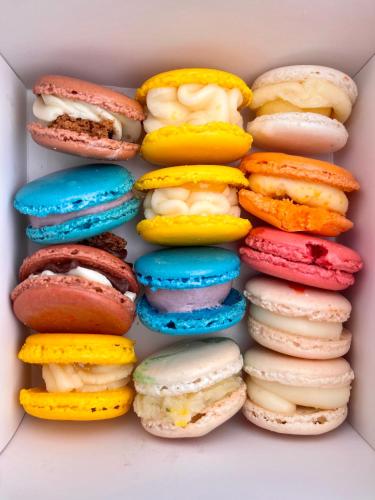 a box filled with different types of donuts at Comfort Suites Chincoteague Island Bayfront Resort in Chincoteague